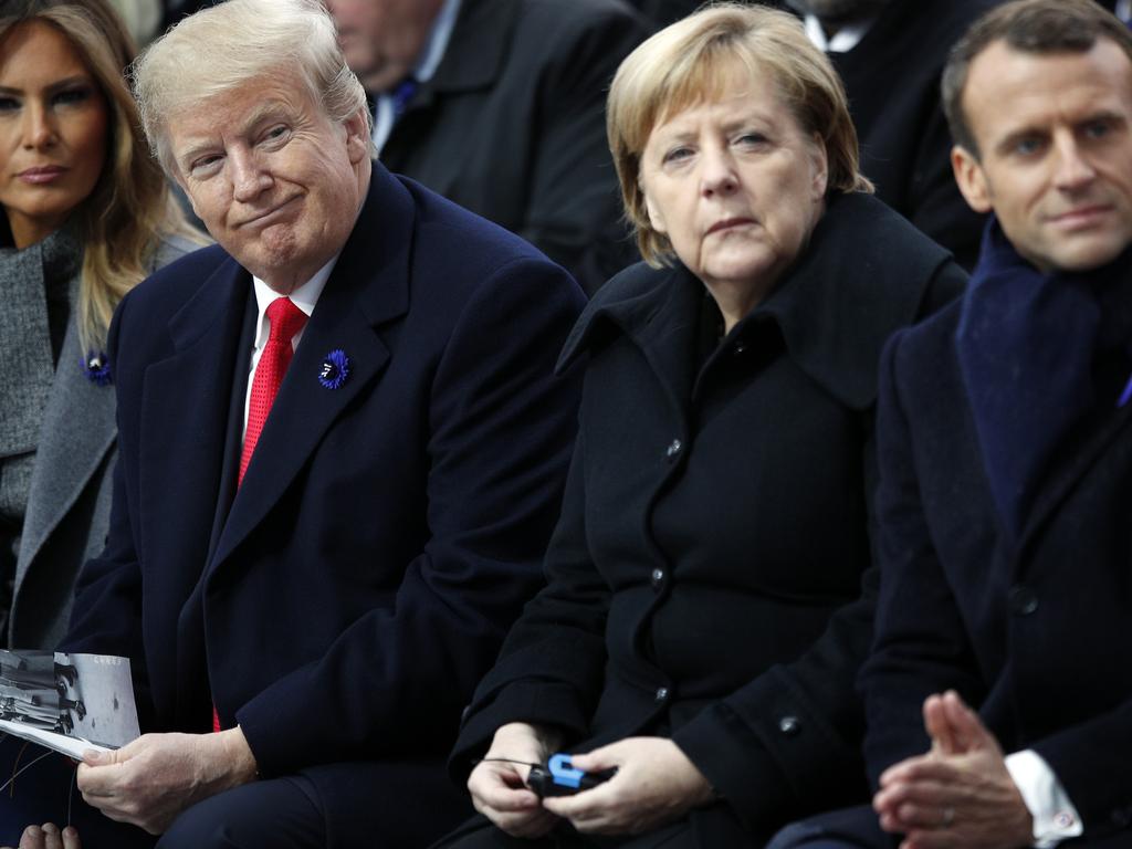 U.S. President Donald Trump, German Chancellor Angela Merkel and French President Emmanuel Macron in Paris. Picture: AP Photo/Francois Mori, Pool, File.