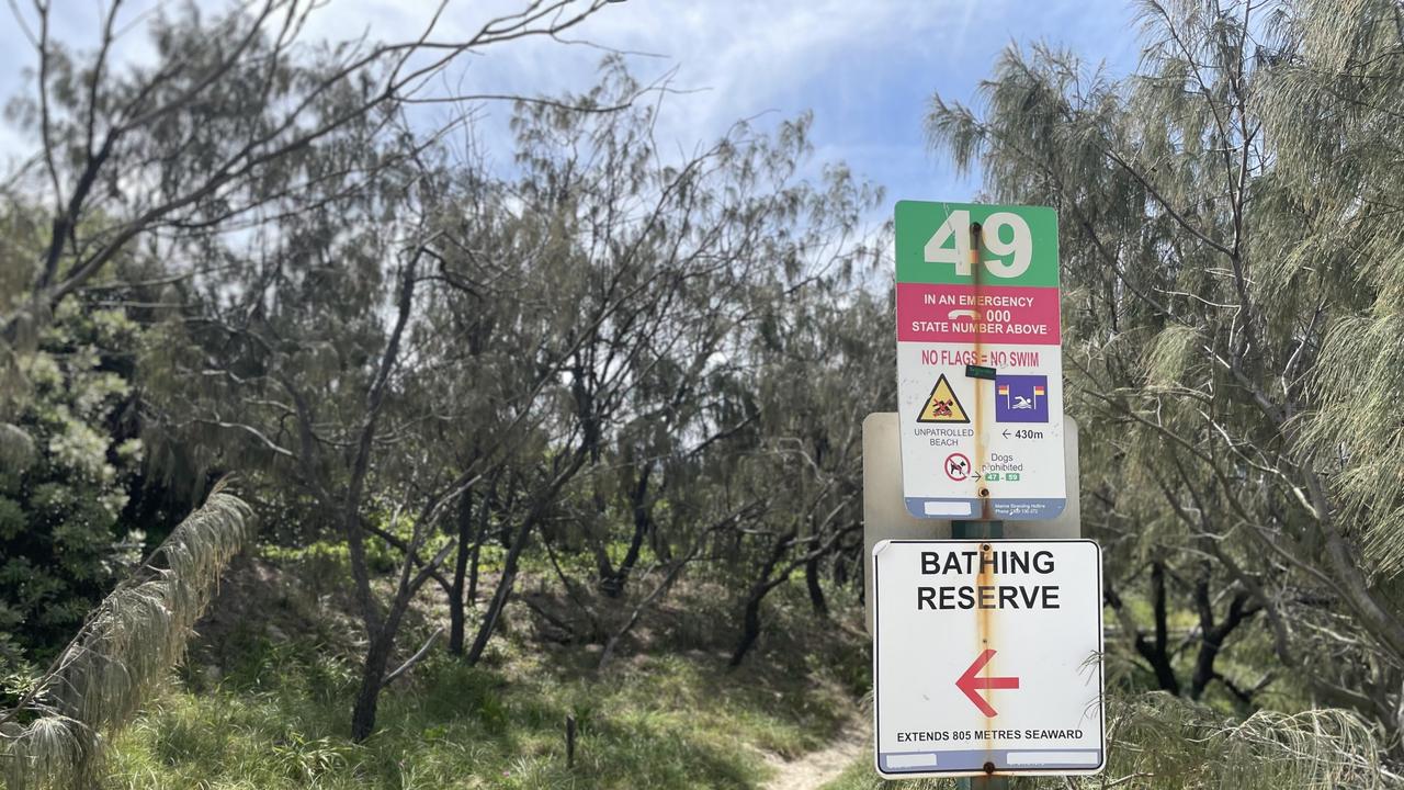 Signs warning of no surflifesaving patrols at access point 49 along Peregian Beach, Sunshine Coast. Photo: Asa Andersen.