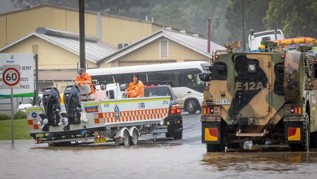 Bushmaster protected mobility vehicles are conducting pre-evacuation tasks with the local SES due to rising flood waters in Lismore and across the Northern Rivers. Photo: ADF
