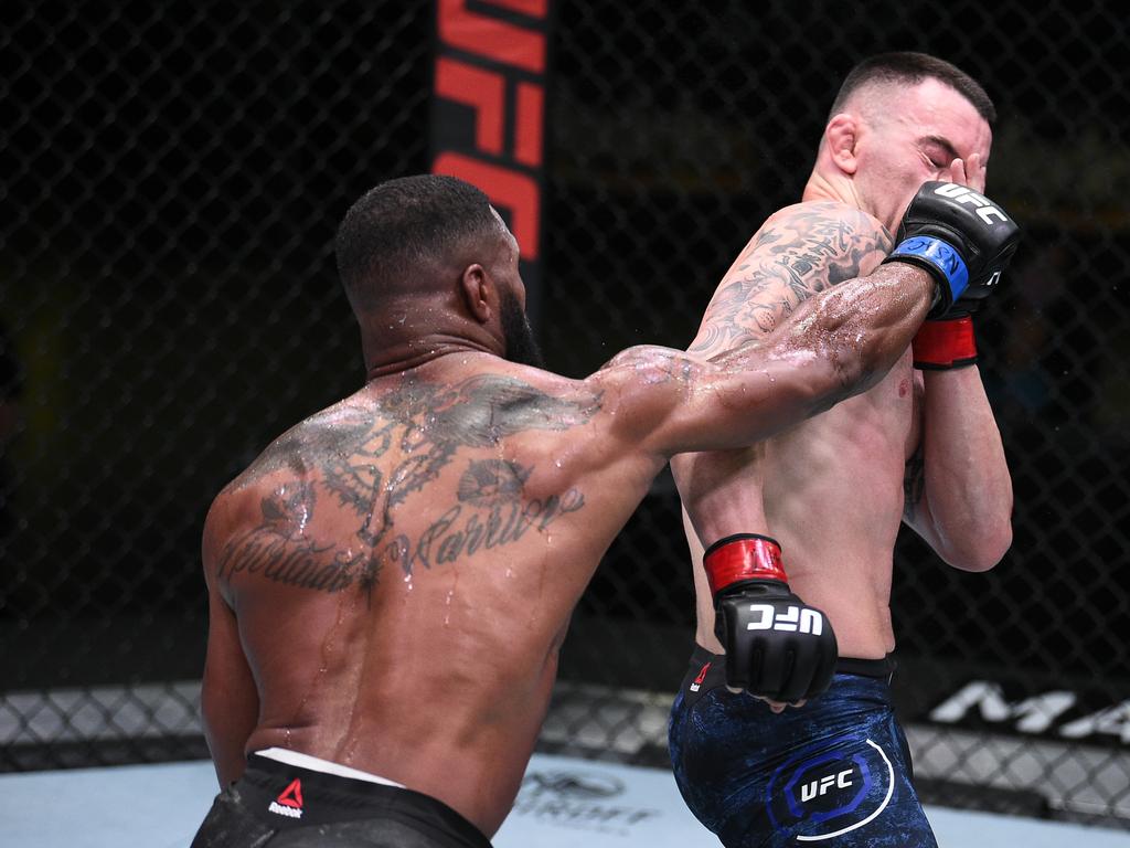 Tyron Woodley punches Colby Covington in their welterweight bout. (Photo by Chris Unger/Zuffa LLC via Getty Images)