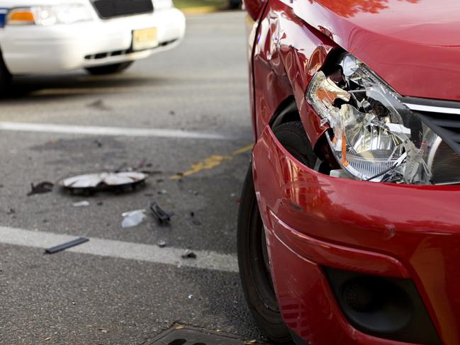 Red Car in an Accident. Image Detail with Selective Focus.