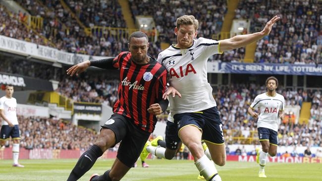 Tottenham Hotspur's Jan Vertonghen, right, competes with Queens Park Rangers' Matt Phillips.