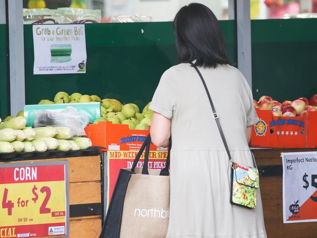 SYDNEY, AUSTRALIA -  Newswire Photos MARCH 14 2023 - A member of the public is seen buying produce and groceries in Sydney as the Cost of living continues to rise. Picture: NCA Newswire / Gaye Gerard.