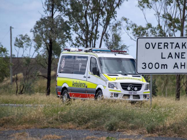 Ambulance leaves the scene of fatal crash involving car and truck on Warrego Highway between Bowenville and Dalby. Sunday, January 30, 2022. Picture: Nev Madsen.