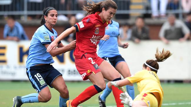 Leena Khamis (left) of Sydney competes for the ball with Cheyenne Hammond (centre) and Eliza Campbell of United during the round 4 W-League match between Sydney FC and Adelaide United at Seymour Shaw Park in Sydney on Sunday, Nov. 27, 2016. (AAP Image/Paul Miller) NO ARCHIVING, EDITORIAL USE