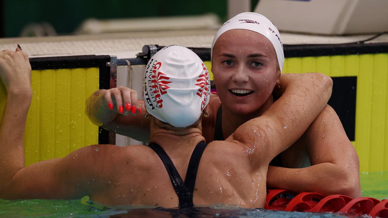 Ariarne Titmus hugs Lani Pallister.