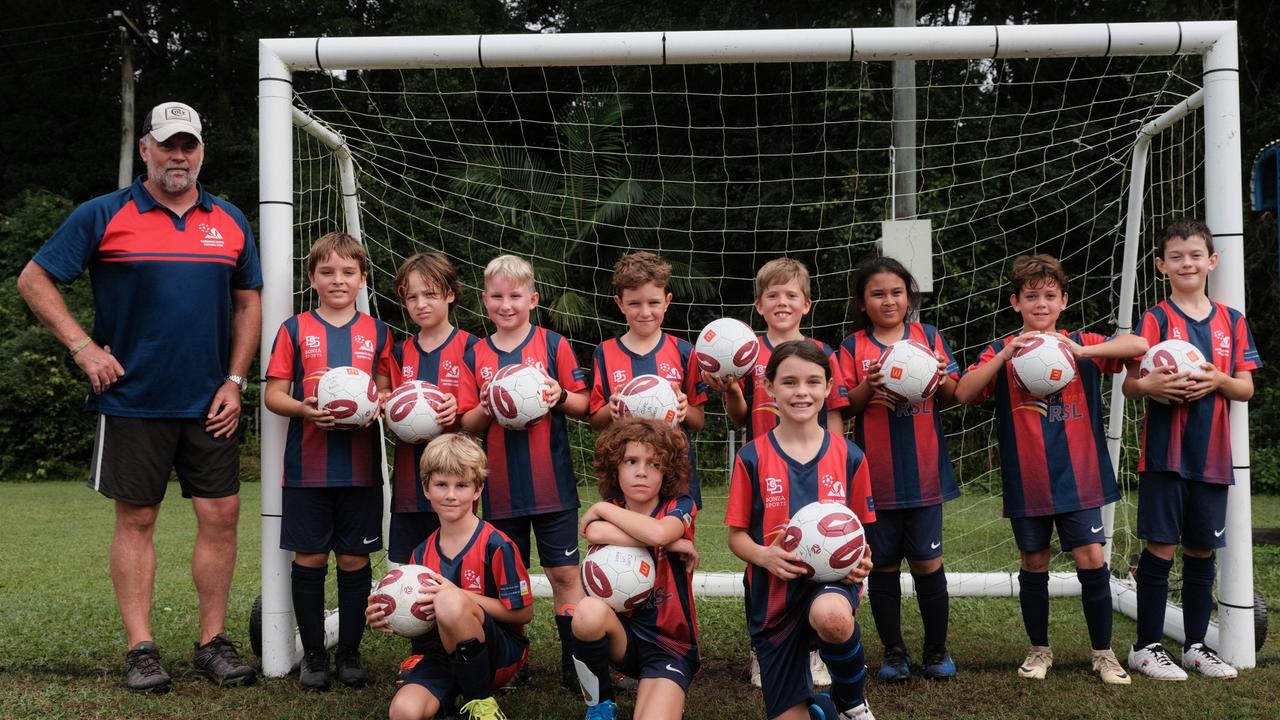 The Cooroora United under-9 Red Wallabies (from back left) coach Mitch, Harry, James, Ozzy, Beau, Finn, Jaden, Harlen, Nash, Bellamy, Jai and Bonnie.