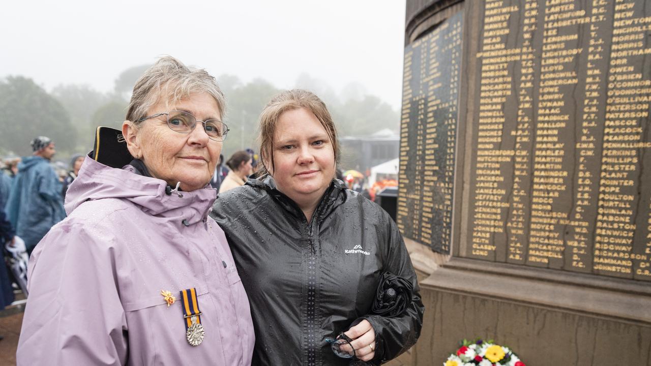 Cathy Fairleigh and daughter Belinda Redman after laying a wreath in honour of their late husband and father 20 year Army vet Garry Fairleigh at the conclusion of the Anzac Day Toowoomba dawn service at the Mothers' Memorial, Tuesday, April 25, 2023. Picture: Kevin Farmer