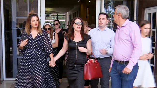 Chris Deutrom’s wife, Helen (centre) leaves the NT Supreme Court after hearing the verdict against her husband. Picture: ABC Darwin