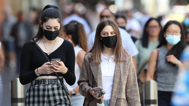 People wearing masks in Melbourne CBD on Tuesday. Picture: David Crosling