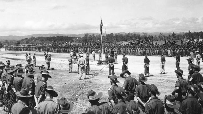 The flag raising at the Japanese World War II surrender ceremony at Wewak, New Guinea, on September 13, 1945.