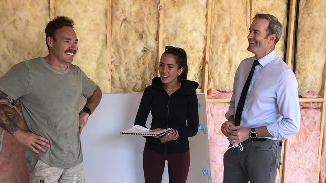 Jason Zadow and Hannah Graham in the granny flat under construction on their Ravenswood property, with Minister for Housing Michael Ferguson