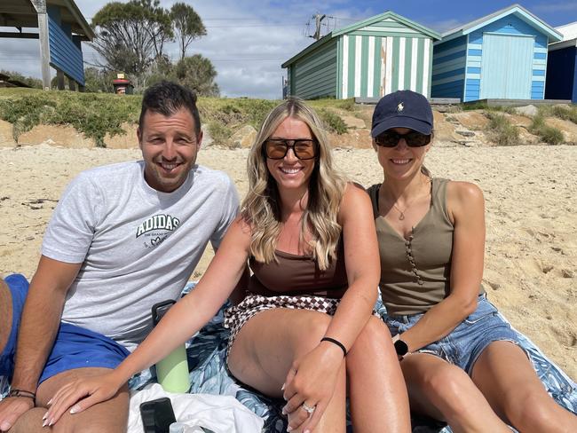 Holiday regulars at Safety Beach Matt and Andriana Petrie with Melbourne friend Natasha Young own up to setting up their cabana early in the morning – 6.30am on hot days – and then coming back later. Picture: Lucy Callander