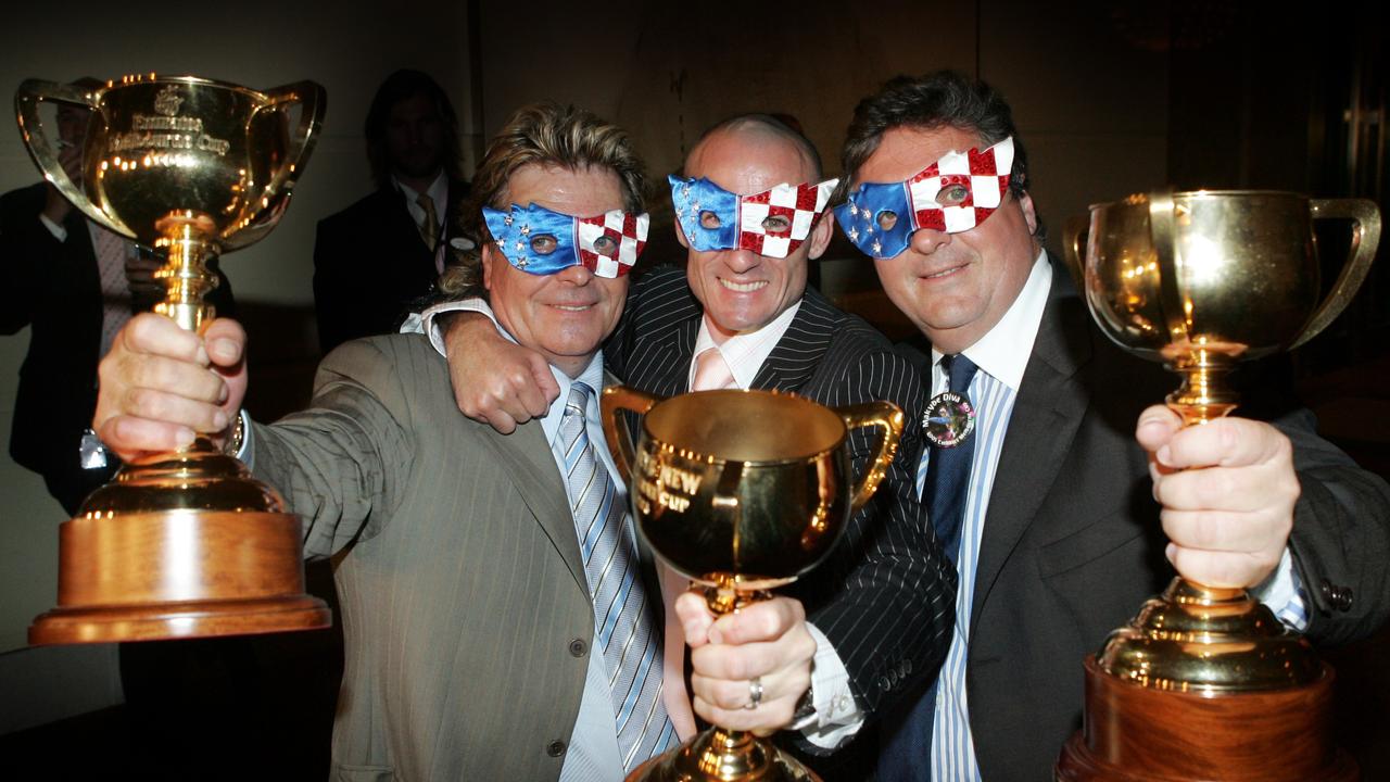 X-VRG NEWS Tony Santic, Glen Boss and Lee Freedman celebrate the win of Makybe Diva after winning the Melbourne Cup for a third year in a row.