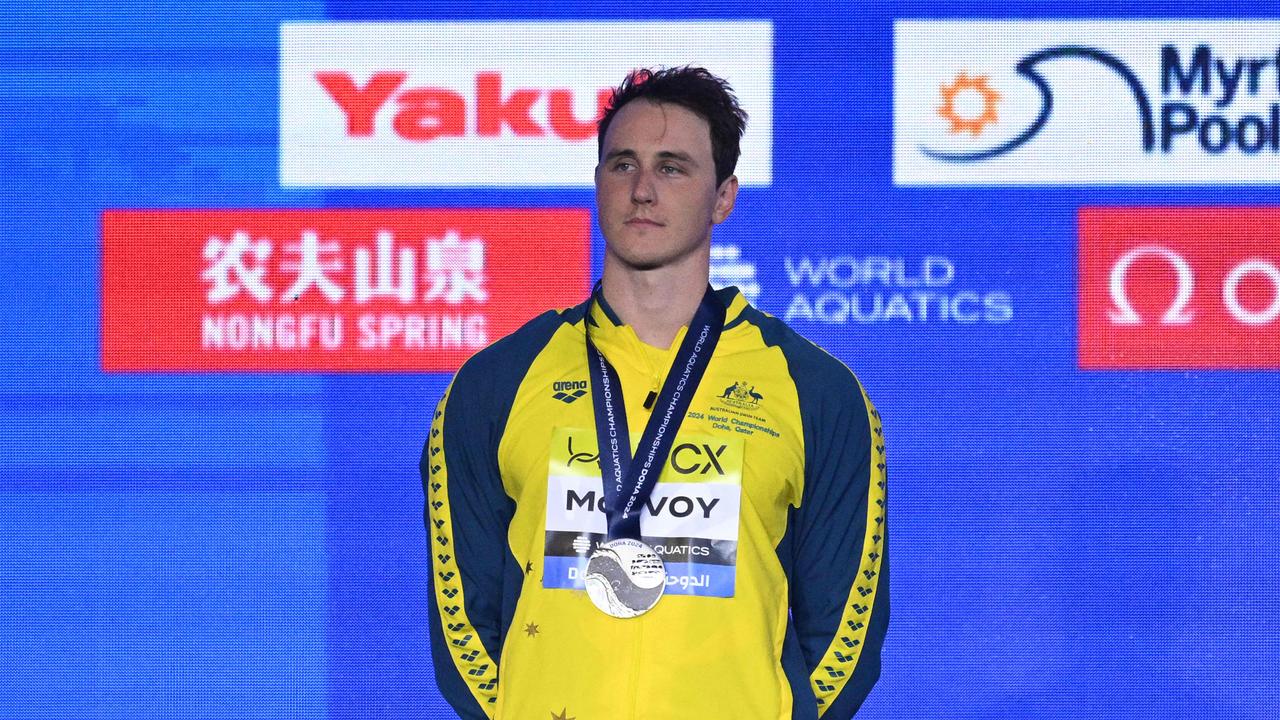 Australia's Cameron McEvoy celebrates with his silver medal on the podium of the men's 50m freestyle swimming event during the 2024 World Aquatics Championships at Aspire Dome in Doha on February 17, 2024. (Photo by Oli SCARFF / AFP)