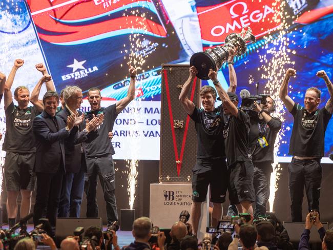 Pietro Beccari front, left, in Barcelona to present The Auld Mug to Emirates Team New Zealand at the Louis Vuitton 37th America's Cup.