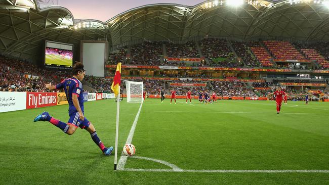 Yasuhito Endo of Japan takes a corner kick against Jordan.