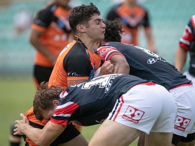 Michael Boustany is hit hard in a tackle. Picture: Julian Andrews