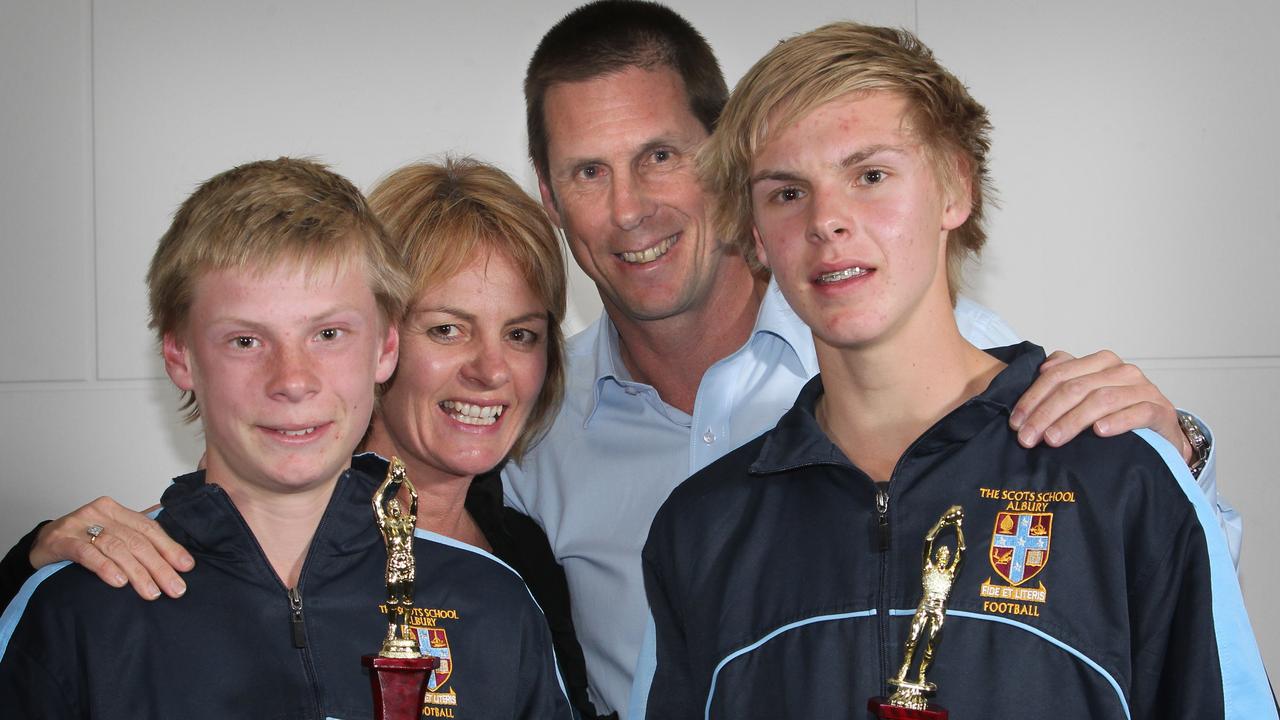 Father Paul, mother Kate with their boys after Charlie won the 2012 Under-13 Albury Junior Football’s best &amp; fairest. and older brother Abe took out the Under-14 best &amp; fairest.