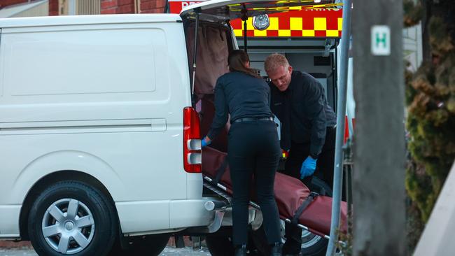 A body was removed from the rubble of the Newtown building on Tuesday afternoon. Picture: Justin Lloyd