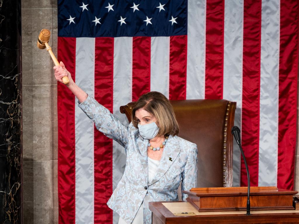 Speaker of the House Nancy Pelosi holds the Speaker's gavel in the air on the House floor in the US Capitol after becoming Speaker of the 117th Congress in Washington, DC. Picture: AFP