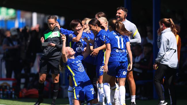 Sam Kerr of Chelsea celebrates with teammates after scoring their team's fourth goal. Photo by Catherine Ivill/Getty Images.