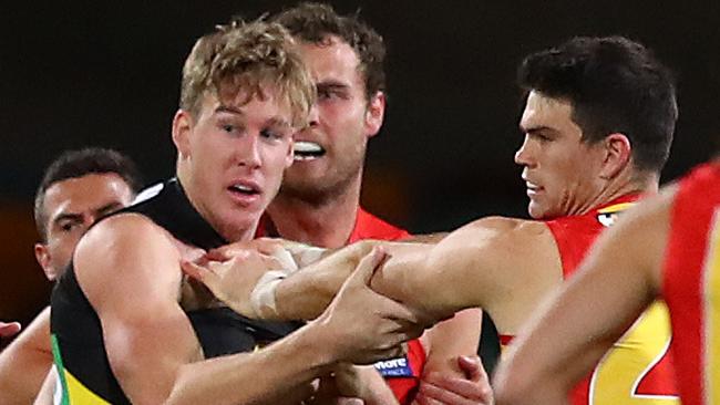 BRISBANE, AUSTRALIA - AUGUST 17: Tom J. Lynch of the Tigers scuffles with Sam Collins of the Suns during the round 12 AFL match between the Richmond Tigers and the Gold Coast Suns at The Gabba on August 17, 2020 in Brisbane, Australia. (Photo by Jono Searle/AFL Photos/via Getty Images)