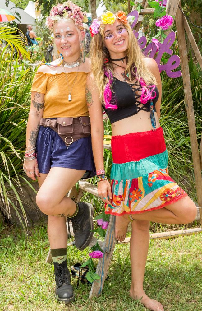 Georgia Landesmann from Morayfield (left) and Fernanda Martinelli from Brazil pose for a photograph at Woodford Folk Festival, Saturday, December 30, 2017. (AAP Image/Richard Walker)