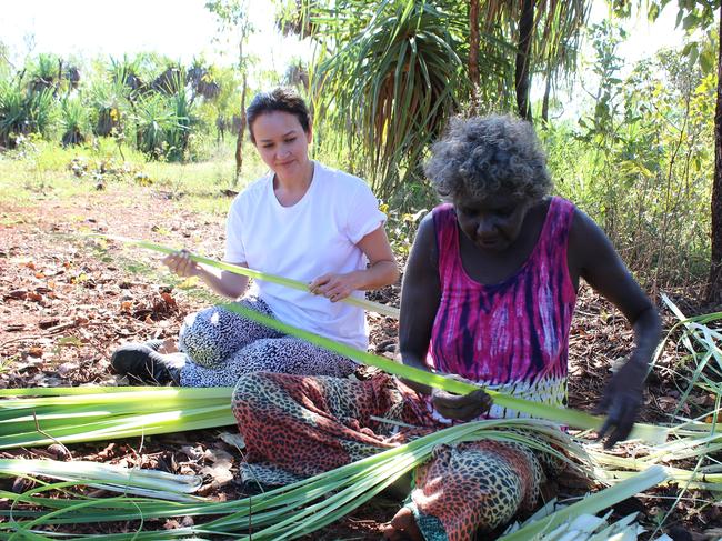 Evonne Munuyngu (right) teaches weaving techniques to designer Julie Shaw of Maara Collective.