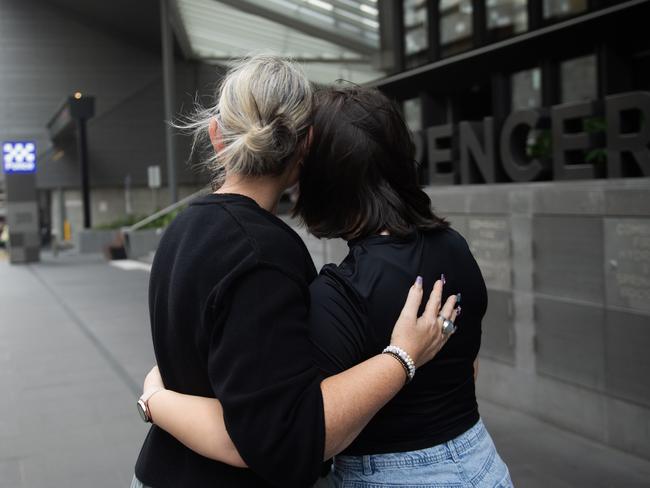 MELBOURNE AUSTRALIA - Newswire Photos DECEMBER 13TH 2023 : The mother with her daughter, who was the victim of the recent school girl abduction in Hosier Lane, speak to the media at Police HQ, Melbourne. PICTURE : NCA Newswire / Nicki Connolly**not be identified**