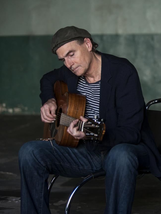 James Taylor at work, and at play, with a favourite guitar. Picture: James O'Mara