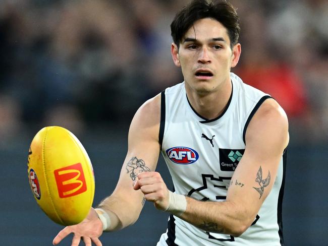 MELBOURNE, AUSTRALIA - JUNE 02: Zac Fisher of the Blues handballs during the round 12 AFL match between Melbourne Demons and Carlton Blues at Melbourne Cricket Ground, on June 02, 2023, in Melbourne, Australia. (Photo by Quinn Rooney/Getty Images)