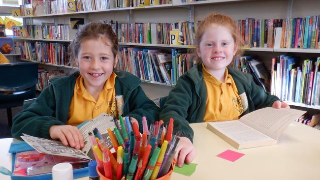 Bunnaloo Public School stage 2 students Ruby Rogan (l) and Georgie Barnes read in the library. Picture: supplied