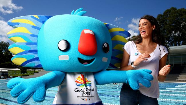 Commonwealth Games medallist Stephanie Rice joins with games mascot Borobi. Pics Adam Head