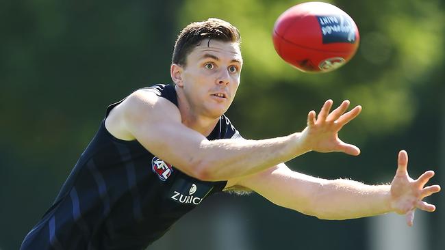 Jake Lever marks the ball during a Melbourne Demons AFL training session.