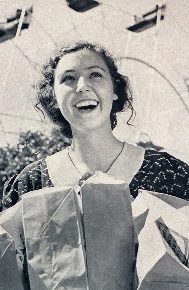 A woman with show bags at Sydney Royal Easter Show, Moore Park.