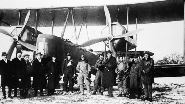 Ross and Keith Smith, James Bennett, Wally Shiers and supporters with their converted Vickers Vimy plane just before take-off at Hounslow Heath. Picture: State Library of South Australia