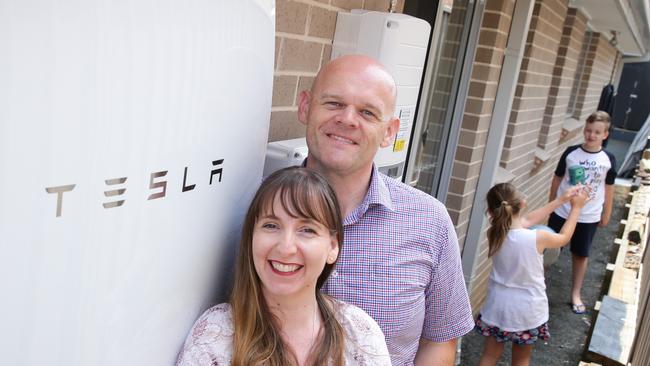 Nick and Danielle Pfitzner and their children Samuel and Hayley with the Teslar powewall at their home. Picture: Renee Nowytarger