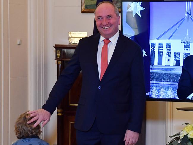 CANBERRA, AUSTRALIA - JUNE 22: Re-elected Leader of the Nationals Barnaby Joyce and son Thomas (left) poses for photographs with Prime Minister Scott Morrison (centre) after being sworn in by Australia's Governor General David Hurley (right) at Government House on June 22, 2021 in Canberra, Australia. Barnaby Joyce has been sworn in as Deputy Prime Minister by Governor-General Hurley today after Joyce deposed former Nationals leader Michael McCormack during a spill called yesterday by Senator Matt Canavan with Joyce re-elected as leader of The Nationals in a leadership contest with at least 12 votes in the 21-member partyroom. (Photo by Sam Mooy/Getty Images)