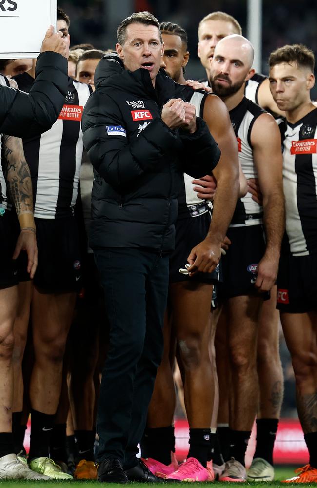 Craig McRae addresses his charges on the MCG on Friday night. Picture: Michael Willson/AFL Photos via Getty Images.