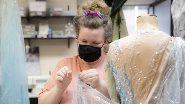 Elyse Horne undertaking wardrobe maintenance for Frozen. Picture: Lisa Tomasetti