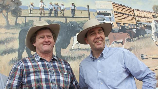 In 2001, political mates Vaughan Johnson and Rob Borbidge against a rural mural at Clermont. Pics Rob Maccoll.