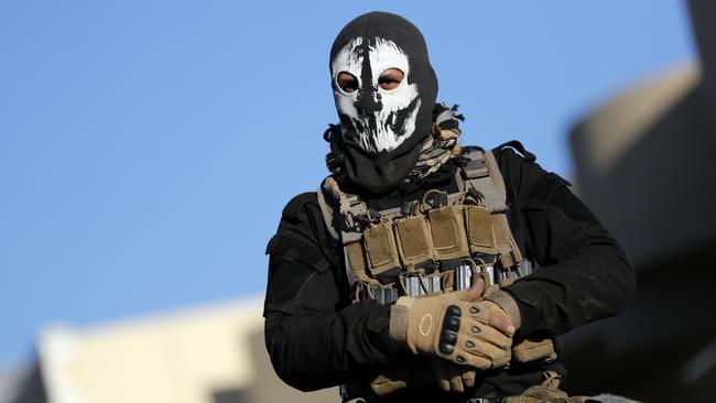 A member of the Iraqi Special Forces wears a skull mask in Mosul in 2016. (Pic: Thomas Coex/AFP)