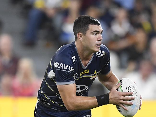 TOWNSVILLE, AUSTRALIA - MAY 08:  Jake Clifford of the Cowboys runs the ball during the round nine NRL match between the North Queensland Cowboys and the Brisbane Broncos at QCB Stadium, on May 08, 2021, in Townsville, Australia. (Photo by Ian Hitchcock/Getty Images)