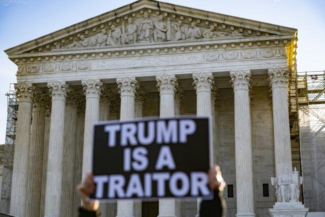 Anti-Trump demonstrators protest outside the US Supreme Court in February 2024 as it considered whether former US president Donald Trump was eligible to run for president in the 2024 election