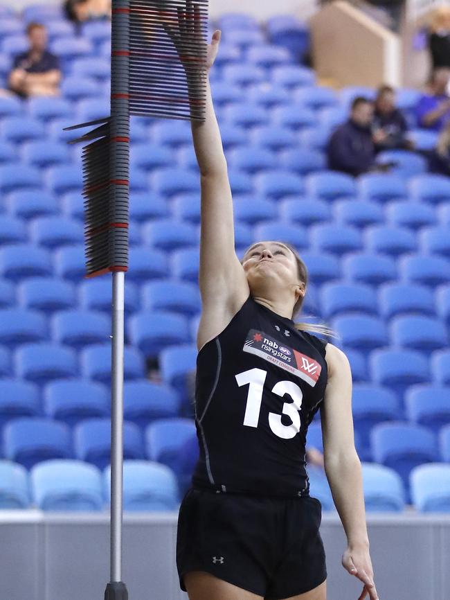 Hannah Munyard during the Combine’s standing vertical jump test. Picture: DYLAN BURNS/AFL PHOTOS VIA GETTY IMAGES