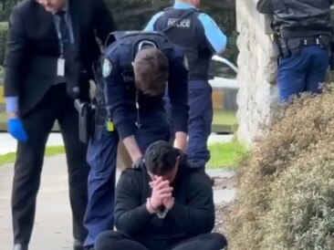 Screen shots from Channel Seven News of the 2 men in balaclavas who were arrested after being spotted in George Street in Dover Heights armed with a gun near the home of John Ibrahim. Picture: Channel 7