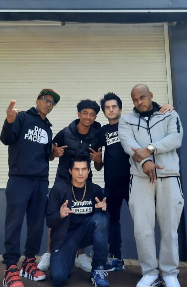 Michael, pictured second from the right of this image with US rap group Onyx, said trolls have slammed the company. Picture: Facebook