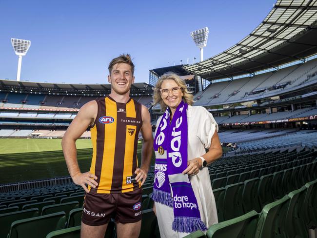 Hawthorn‘s Dylan Moore with Paul Dear’s wife Cherie. Moore wears Paul’s cherished number 13, with Paul dying on pancreatic cancer in 2022. Picture: Wayne Taylor