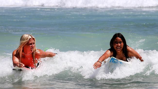 Kiani Dobbyn and Ren Hashimoto at Rainbow Bay. Picture: Mike Batterham